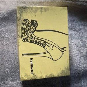 Pair of black and white snake skin heels.